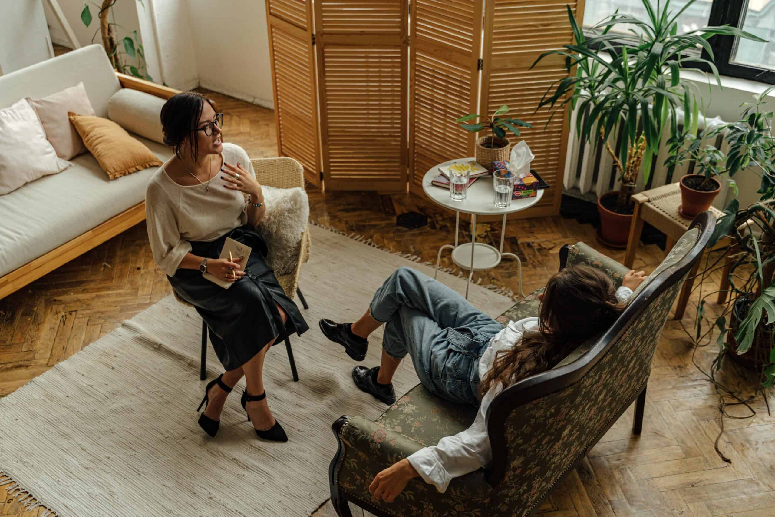 two women sitting in a therapy office